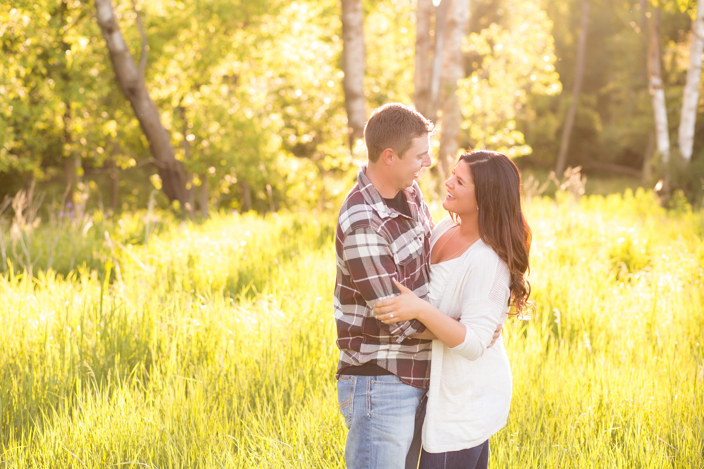 Couple wearing a flannel and blouse for their engagement photos